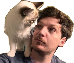 Ben's cat - a ragdoll called Shekar - stands on his shoulder. Ben & Shekar are looking into each others eyes.